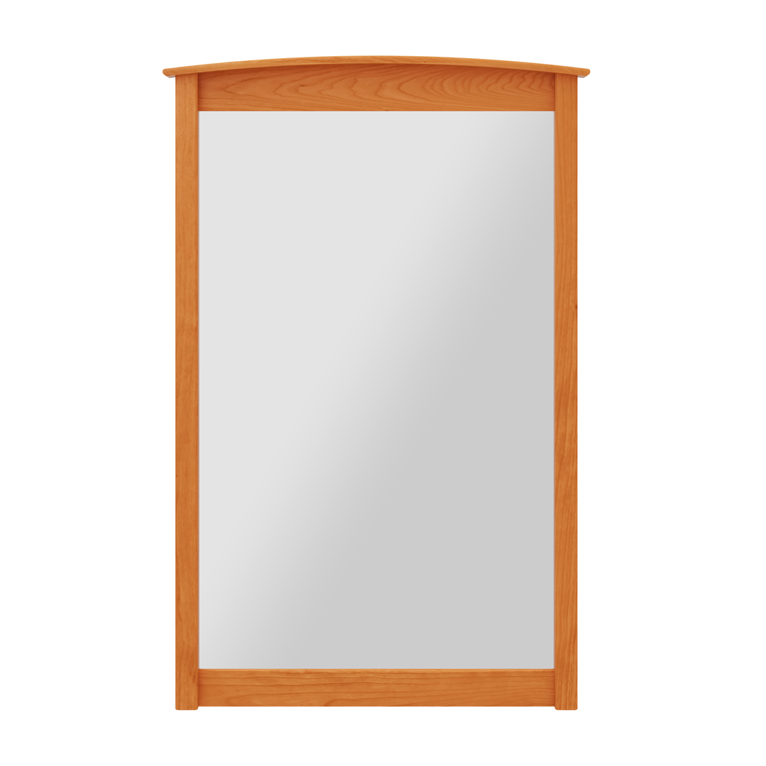 A rectangular, wall-mounted mirror with a hand crafted vermont made wooden frame in a natural cherry wood