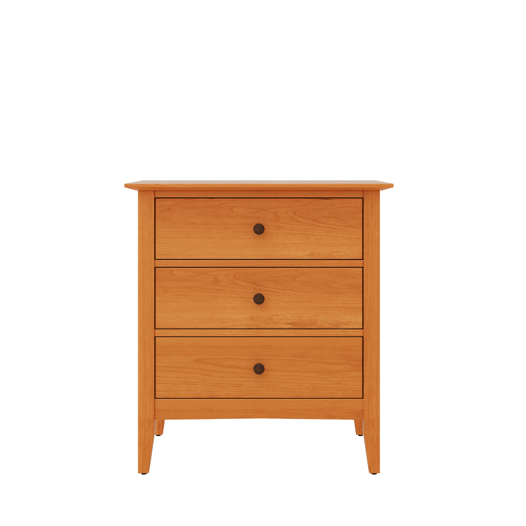 A Modern 3-drawer nightstand in Vermont Wood Studios featuring spacious drawers and metal knobs showcasing Vermont craftsmanship and eco-friendly design. 
