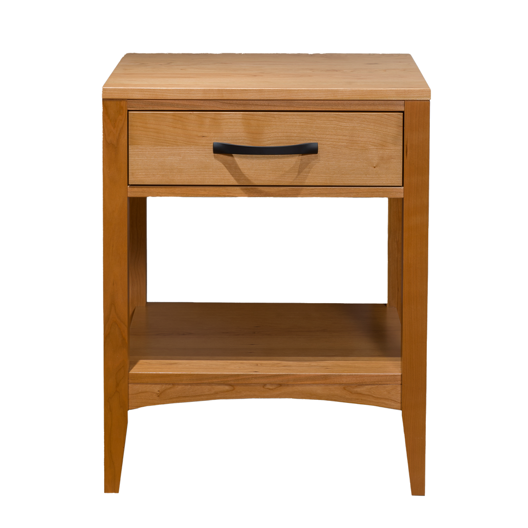A Solid Cherry wooden one-drawer nightstand with a sleek black handle and a lower shelf. A modern traditional marvel. 